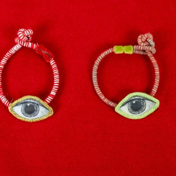 Nefeli Karyofilli Red striped bracelet (green eye)